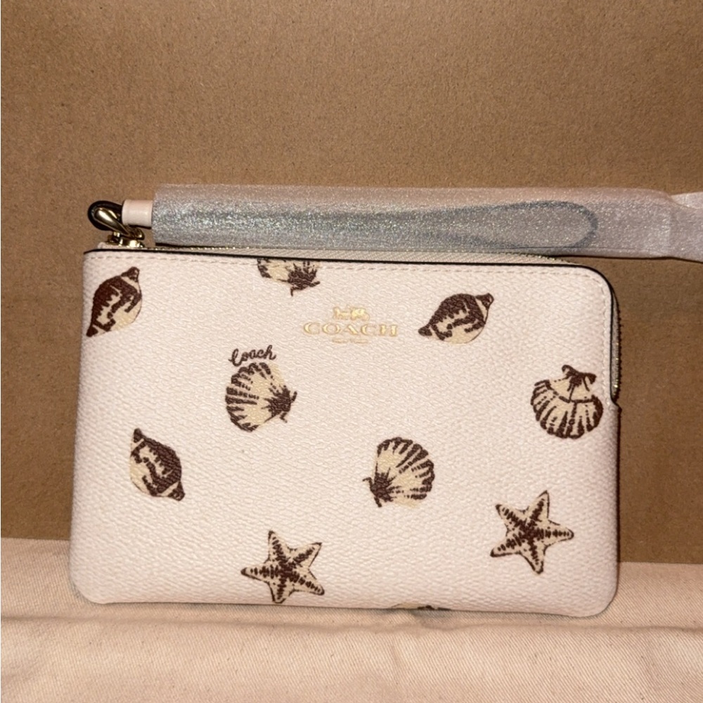 Coach White Wristlet with Brown Seashell Print